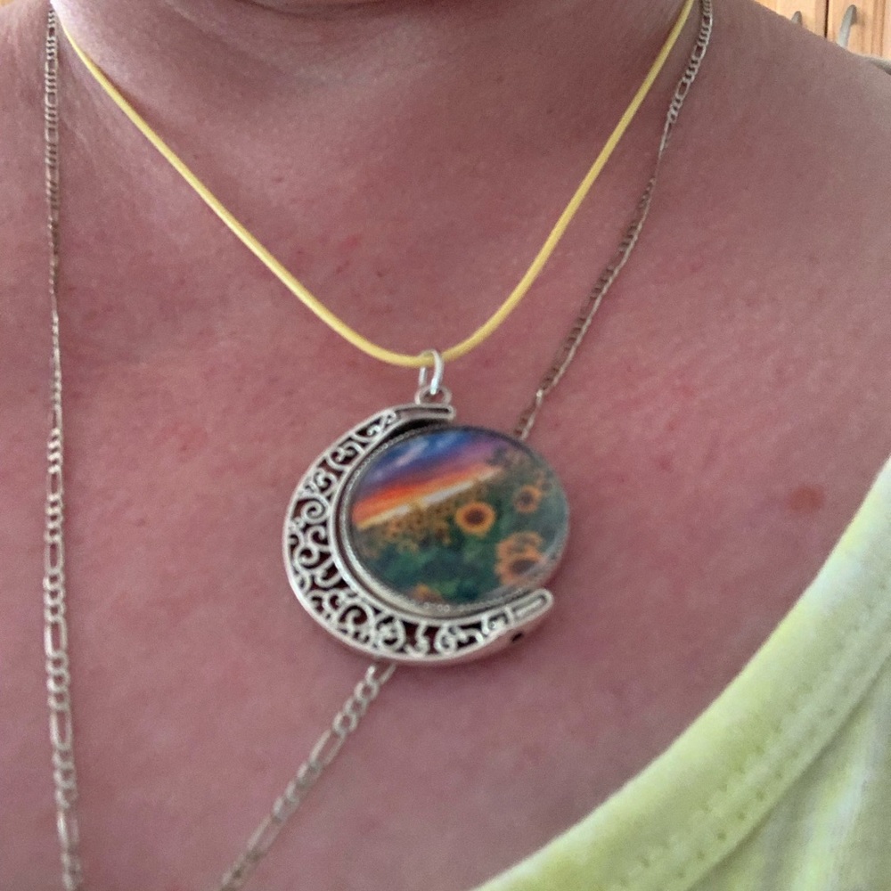 Double sided swinging two image moon charm. made this to order as can you!